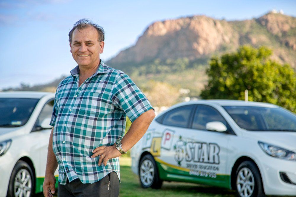 Instructor with Car at the Field — Contact in Townsville QLD