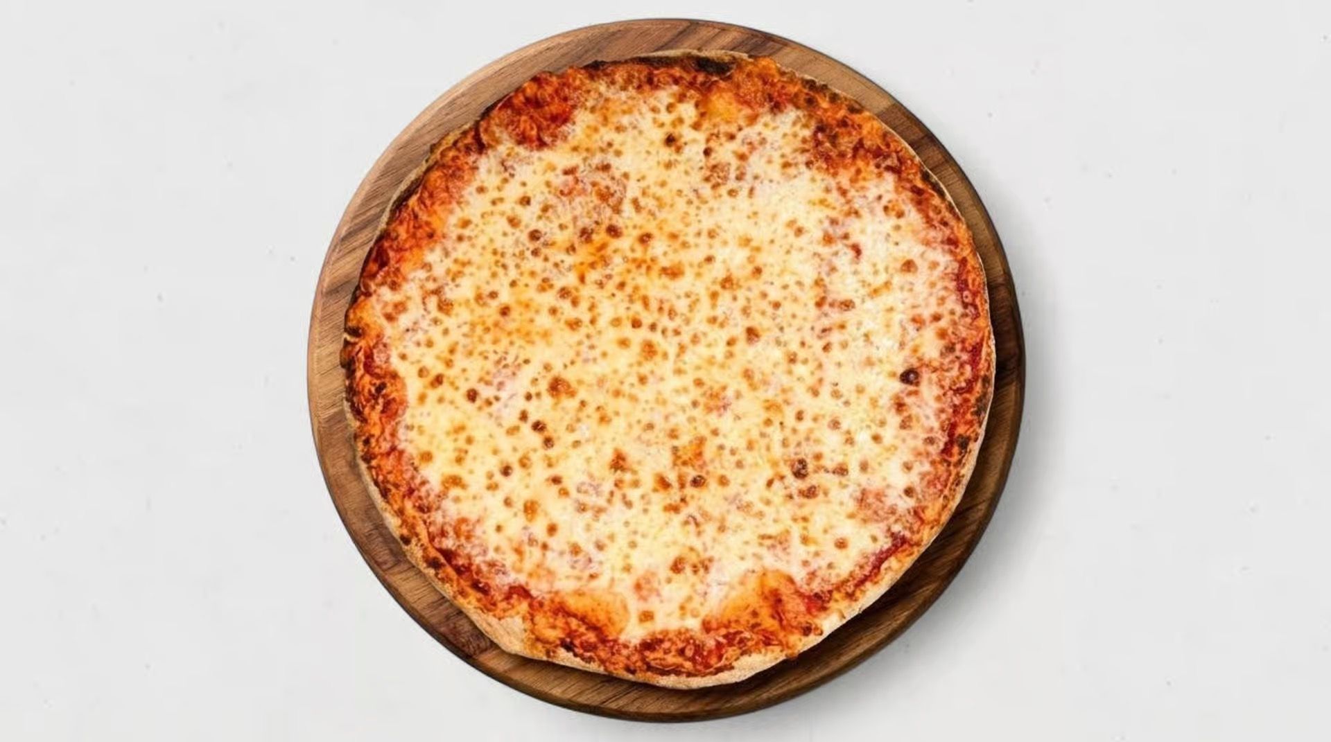 Cheese pizza in a round pan on a white background