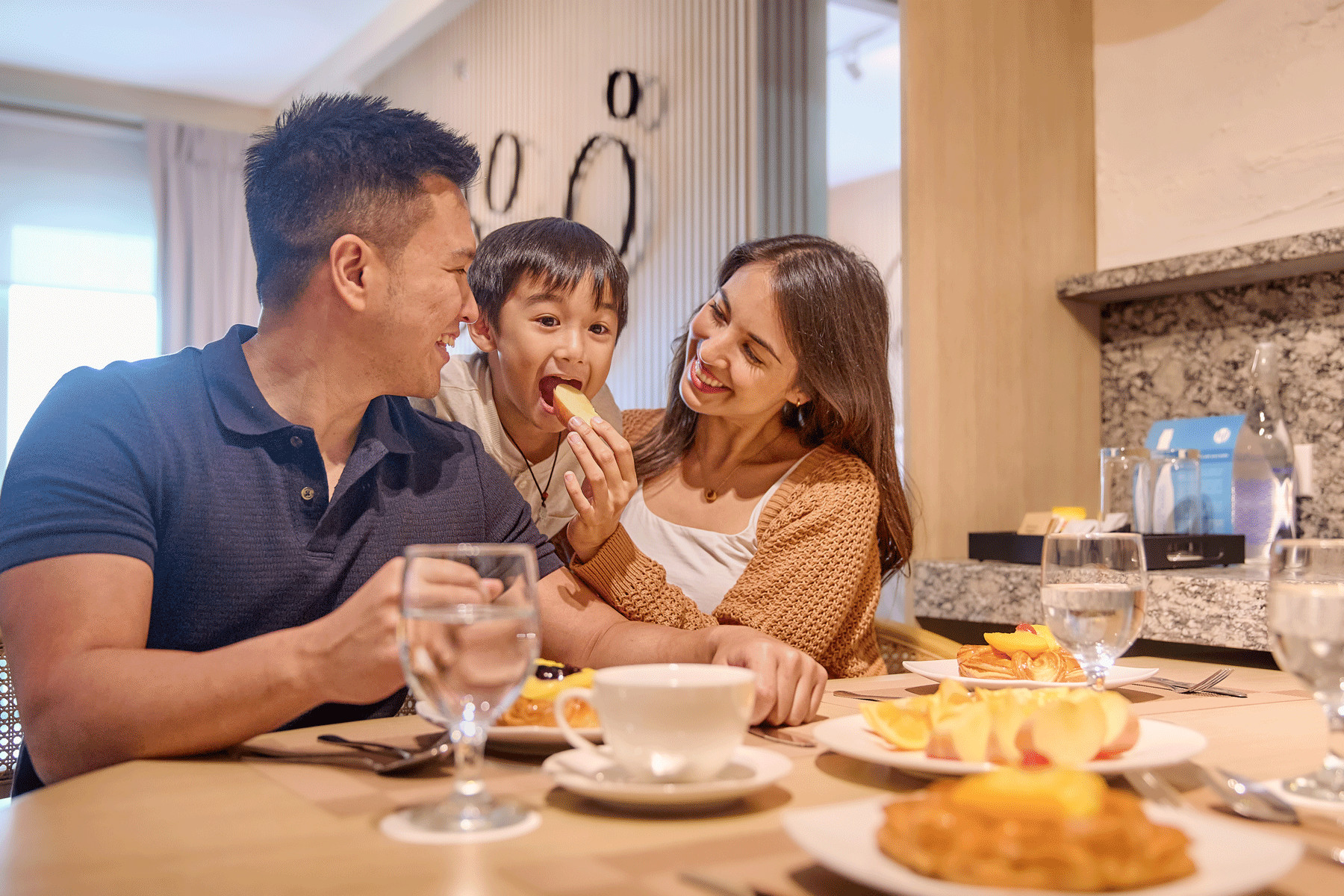 Family enjoying breakfast at Connor Serviced Residences, a premier hotel near Greenhills Manila