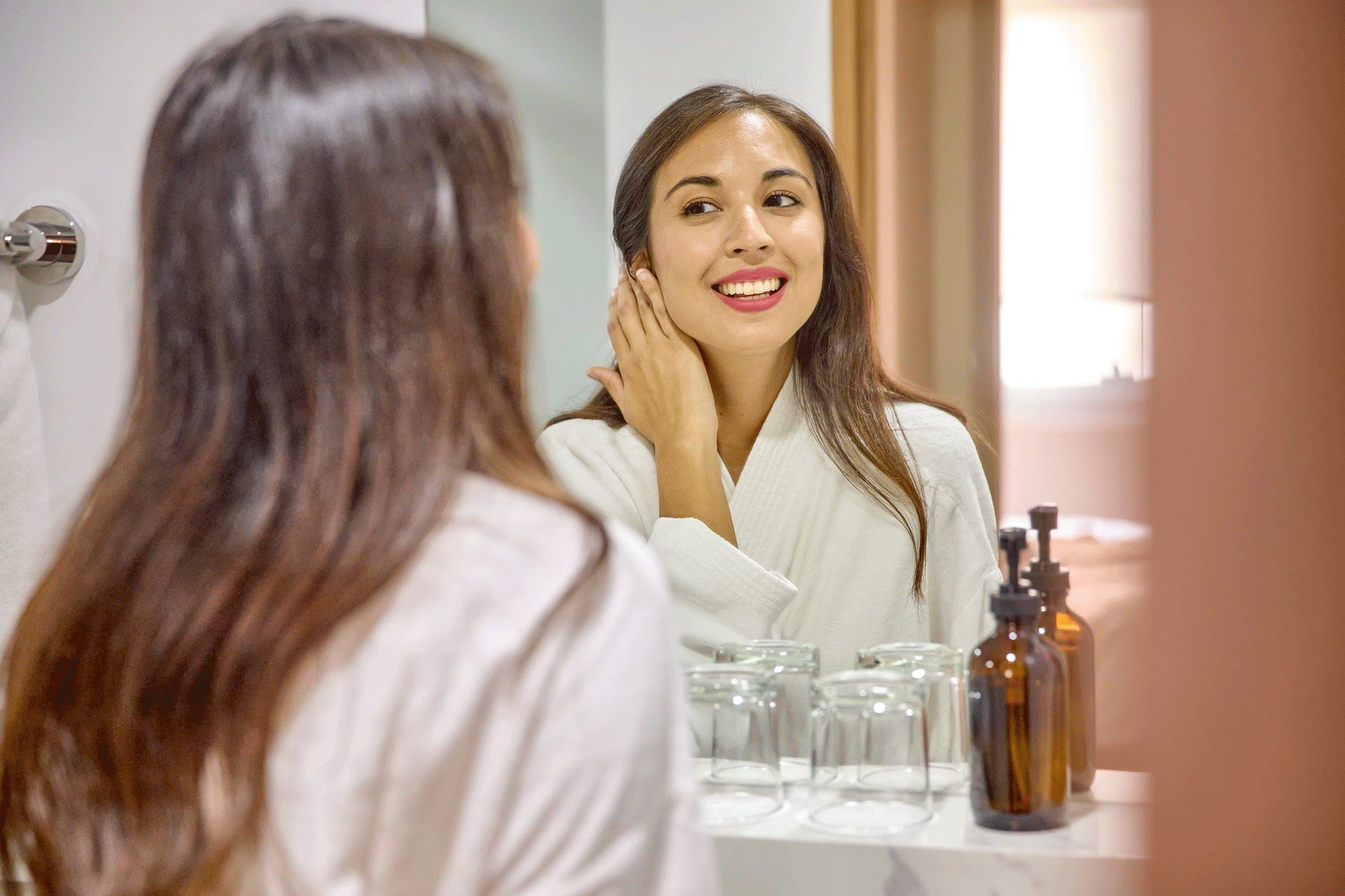 Guest enjoying the vanity area in our modern serviced apartments