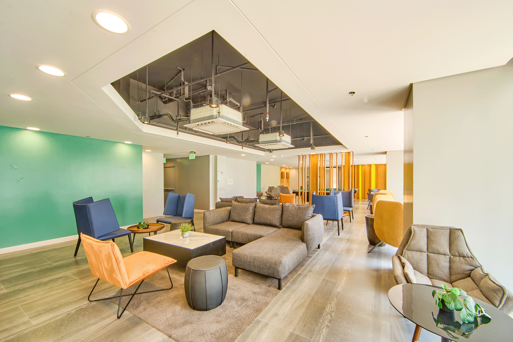Modern resident's lounge at our hotel near Greenhills with contemporary furnishings 