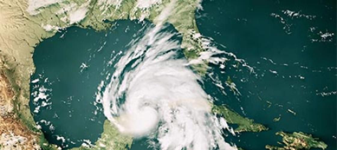 An aerial view of a hurricane in the middle of the ocean.
