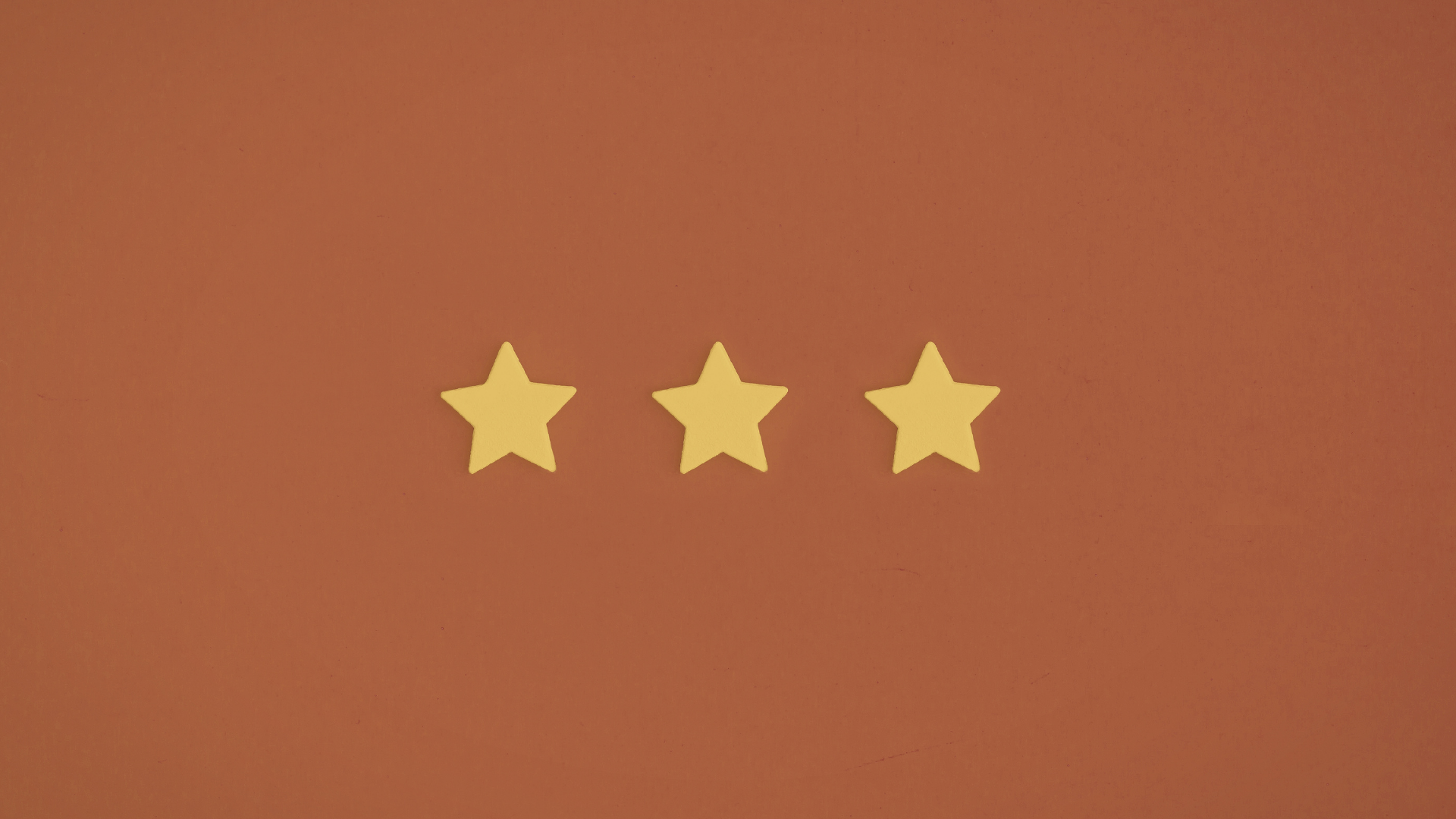 3 stars on an orange background
