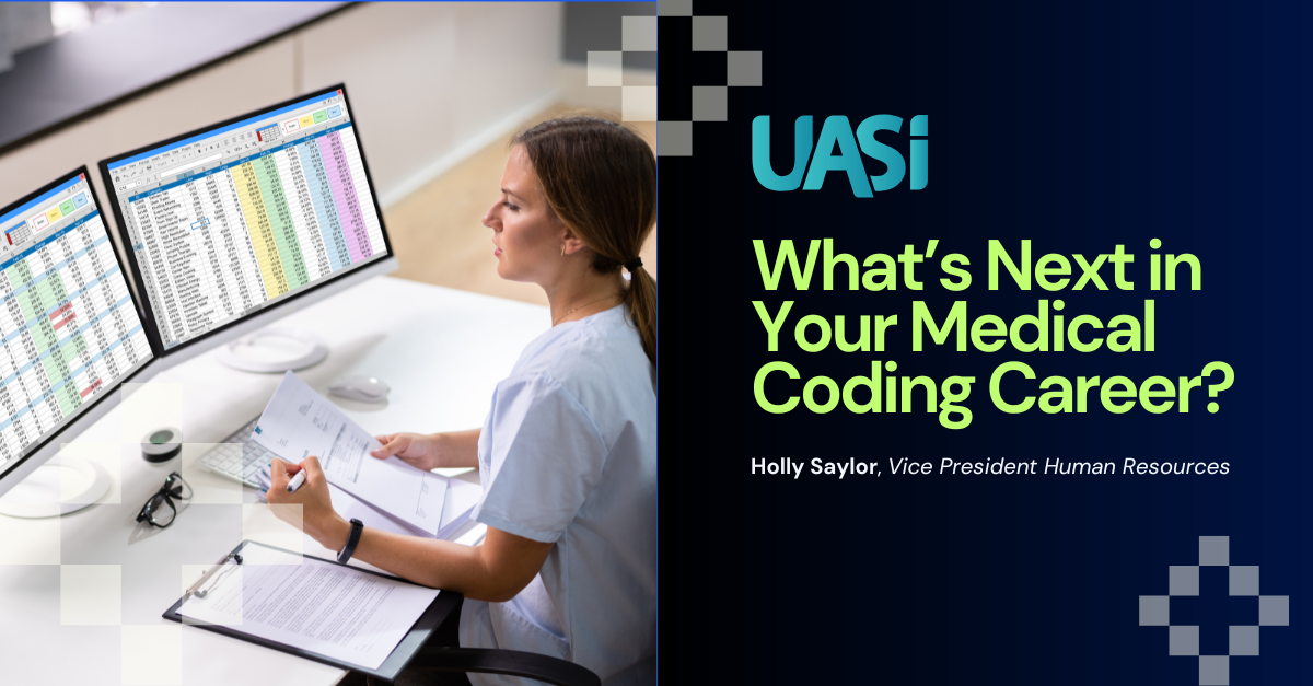 Medical coder at table reviewing database on computer