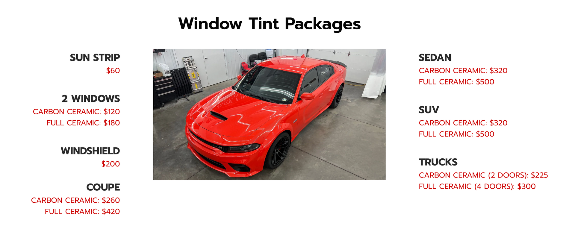 A red car is sitting in a garage next to a window tint package.