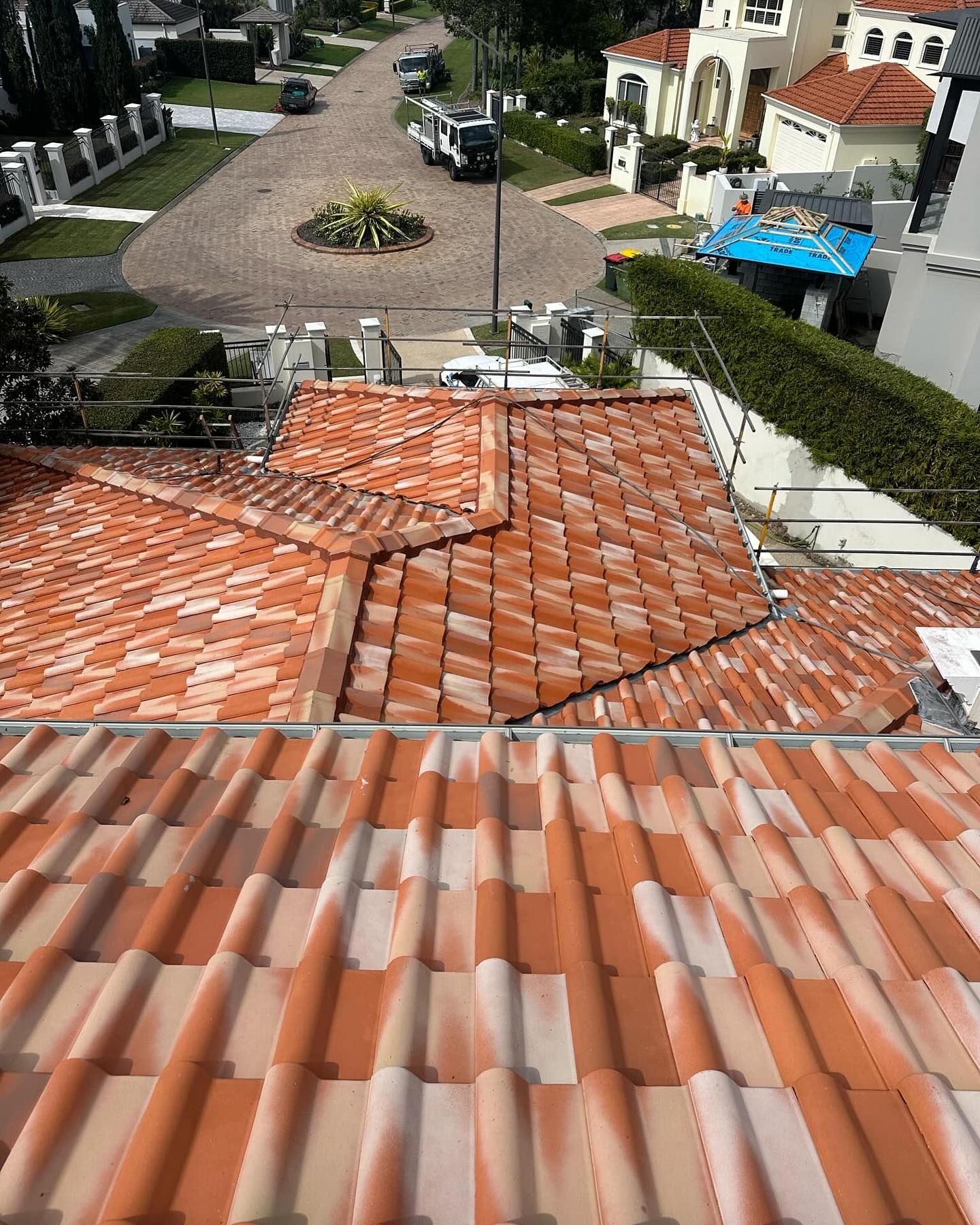View of Red-tiled Roof and Street Flooding With Upscale Homes — Blast It Pressure Cleaning - Gold Coast In Gold Coast, QLD