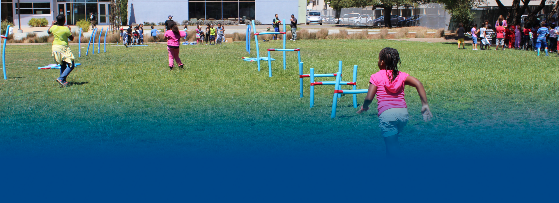 A group of children are playing in a field.