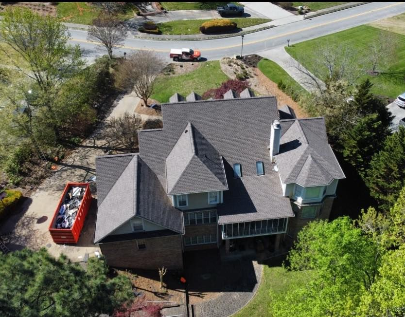 A split-screen view shows a house getting a new roof, with the 