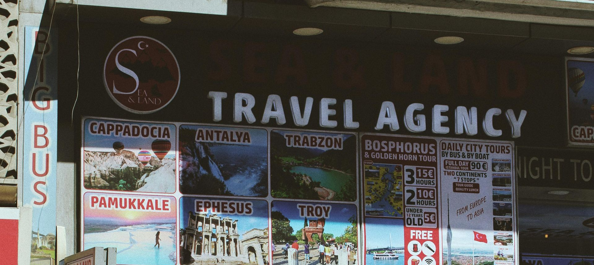 A travel agency with posters advertising destinations like Cappadocia, Antalya, and Ephesus.