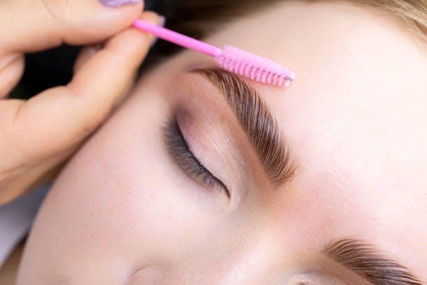 A woman is getting her eyebrows done at Results Skincare Studio in Fort Myers.