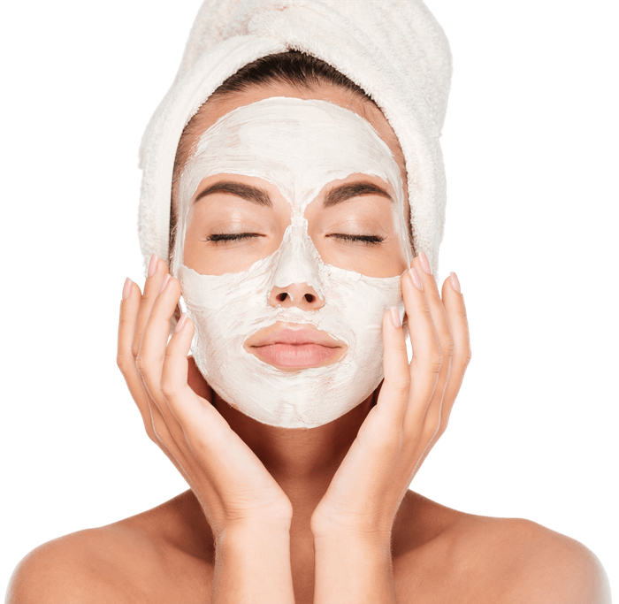 A woman with a towel wrapped around her head getting a facial at Results Skincare Studio in Fort Myers