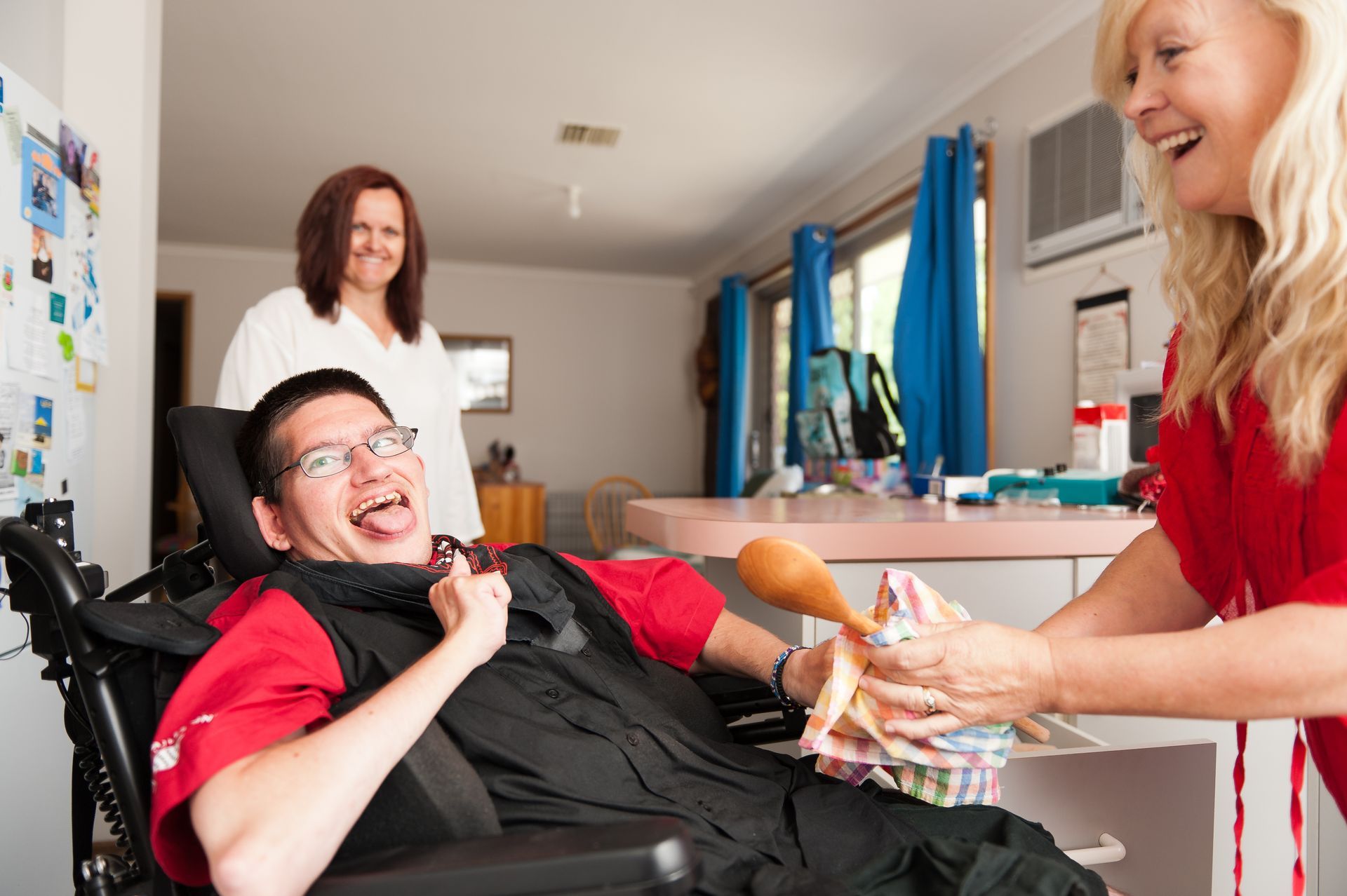 a man in a wheelchair is being helped by a woman