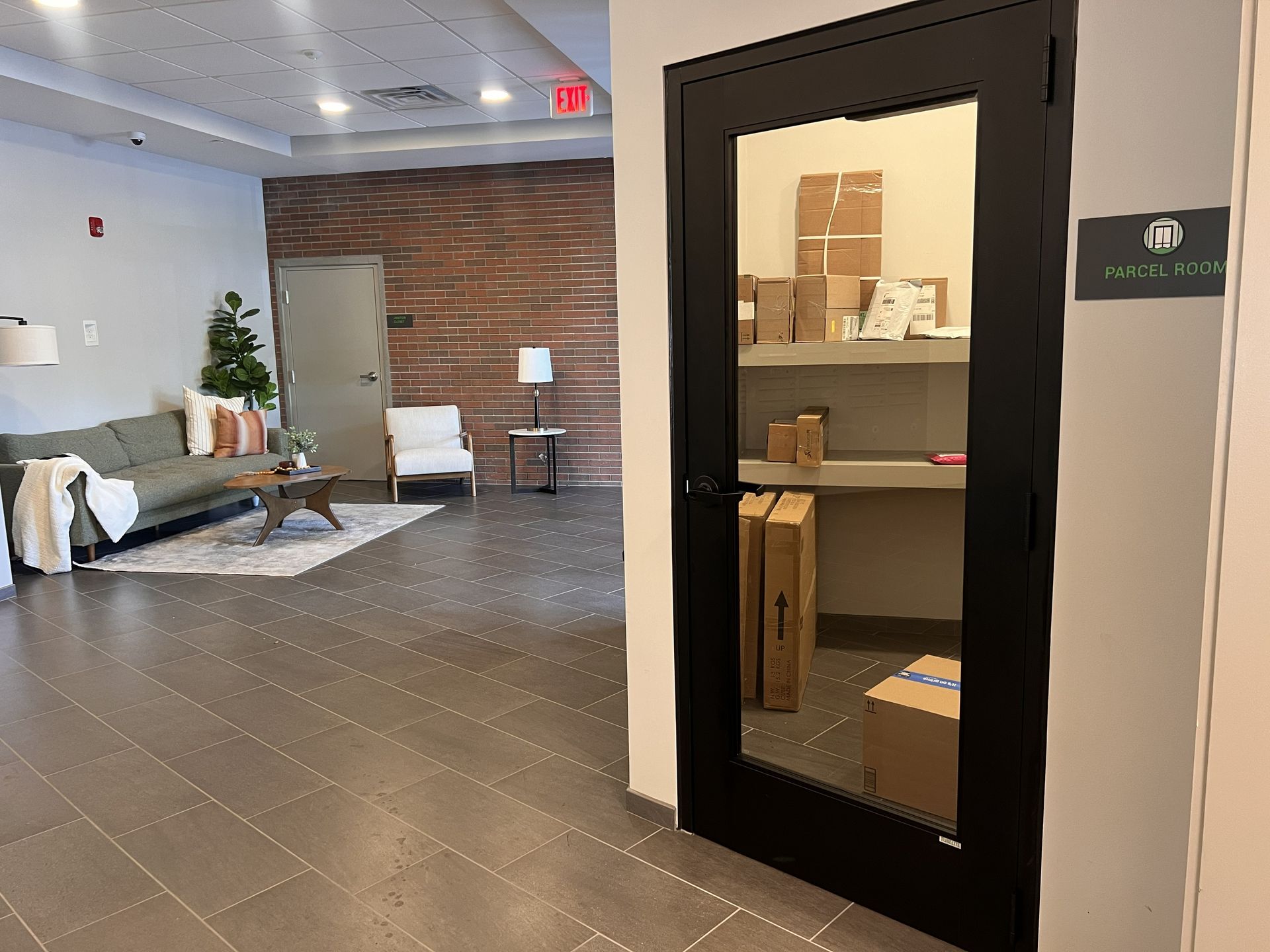 Modern office lobby with seating area and open closet storage room doorway