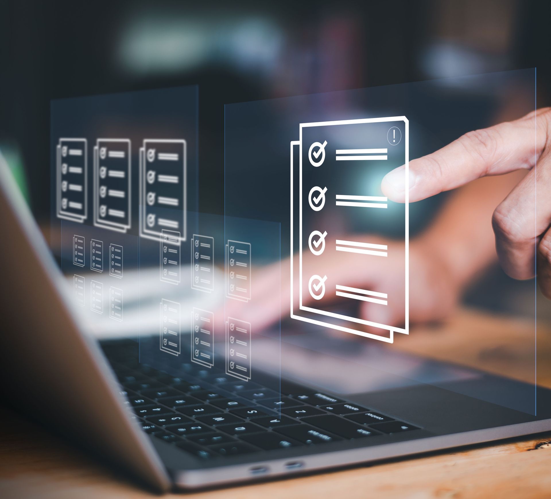 Hand touching a laptop screen with glowing checklist icons on a dark interface