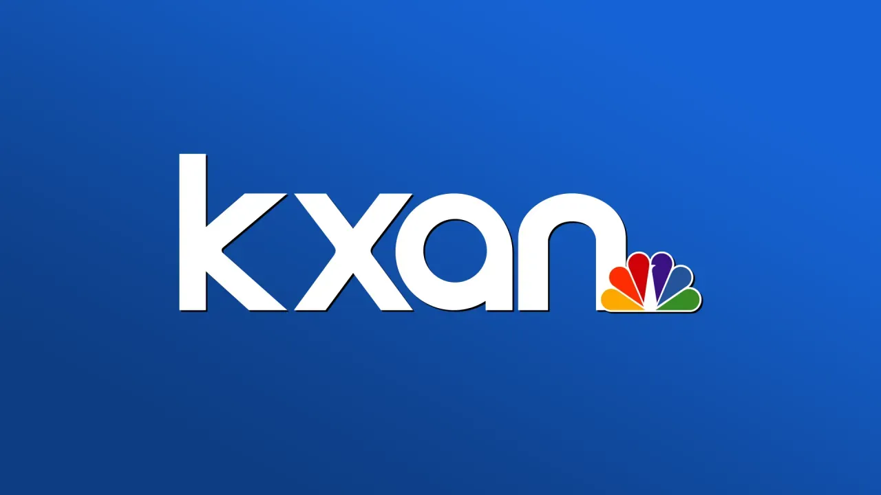 The kxan logo is on a blue background