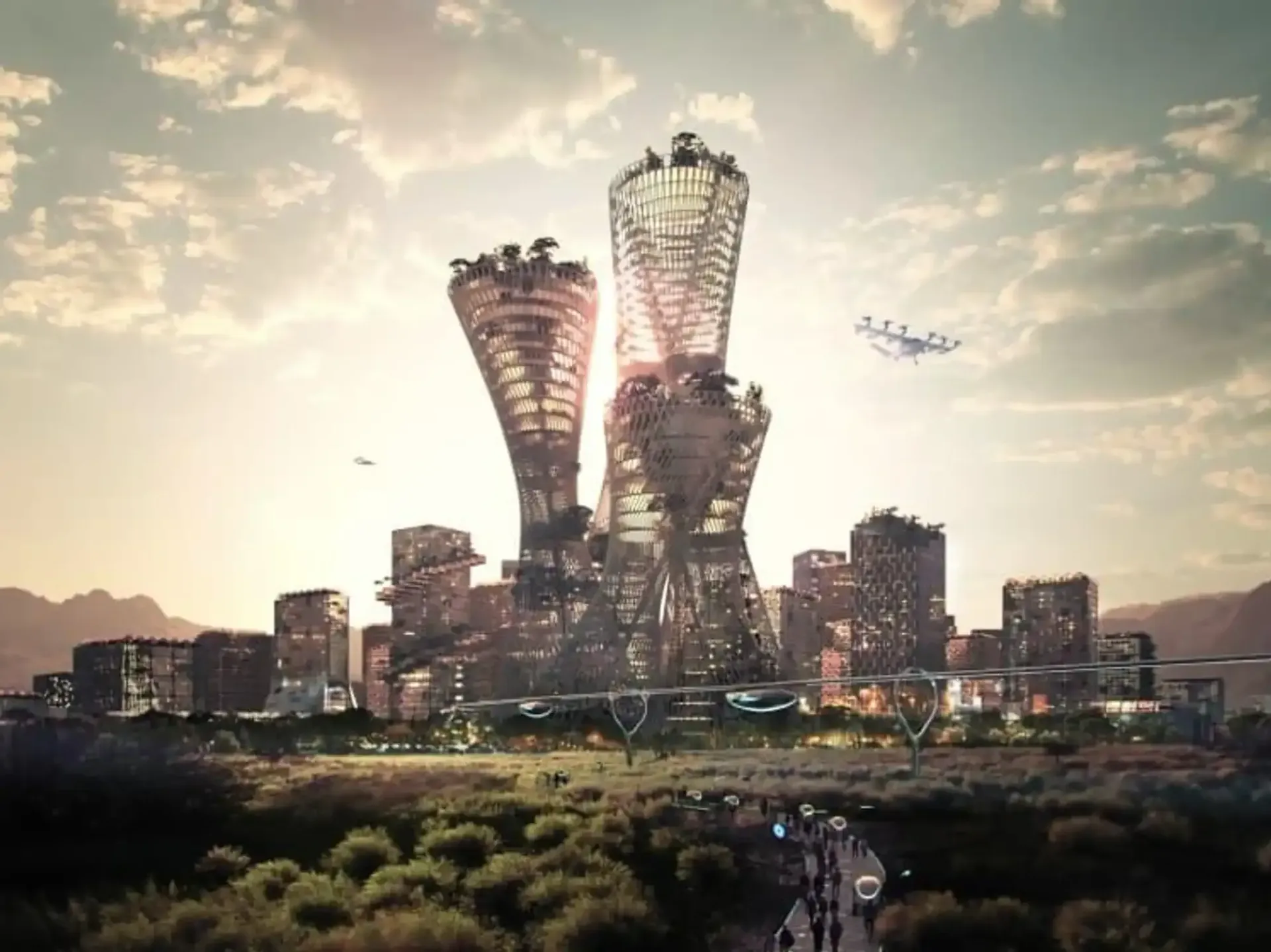 Futuristic city with towering, intricate structures and greenery at sunset, featuring flying drones under a cloudy sky.