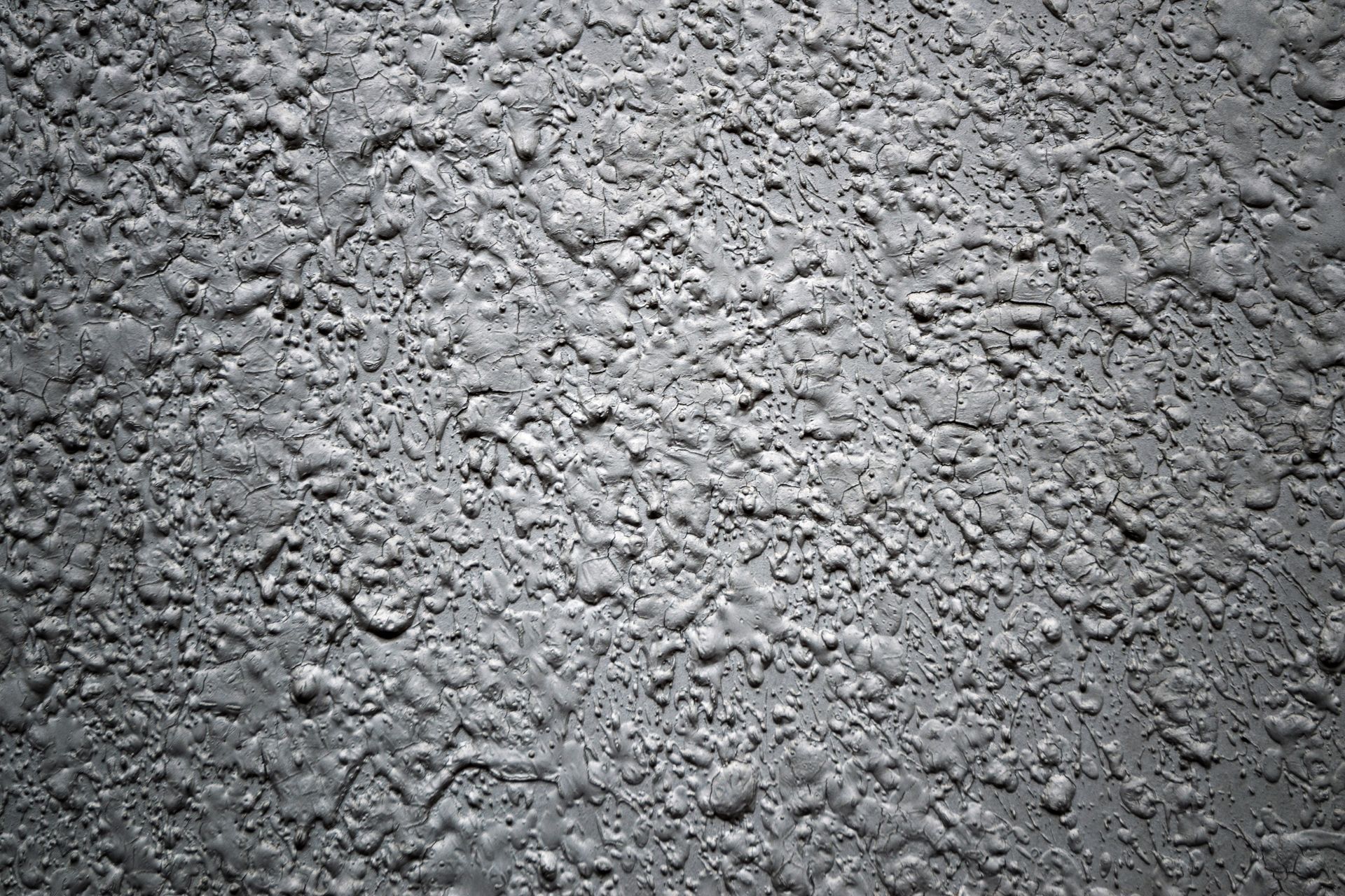 Close-up of rough textured concrete wall in black and white. Close-up of rough textured concrete wall in black and white.