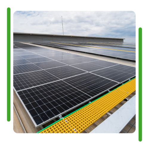 There are many solar panels on the roof of a building. There are many solar panels on the roof of a building.