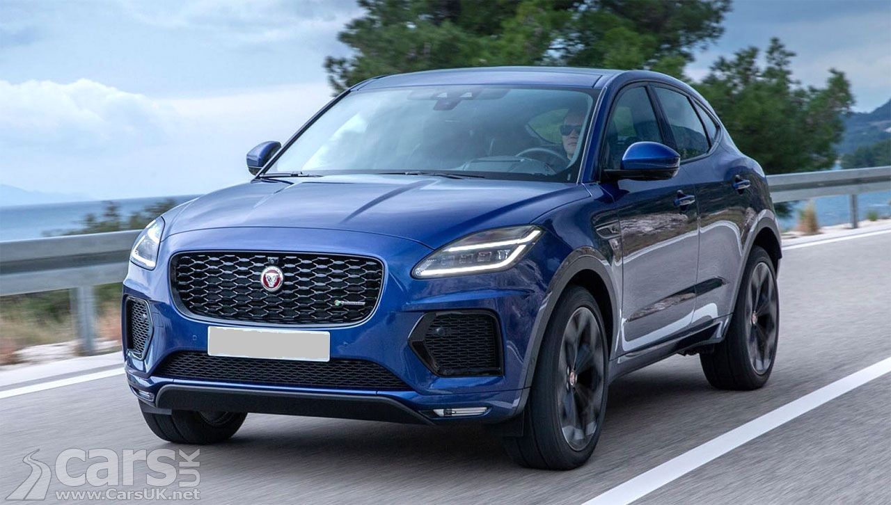 Blue Jaguar E-Pace SUV on a road, front view, black grille, daytime, cloudy sky and ocean in the background.