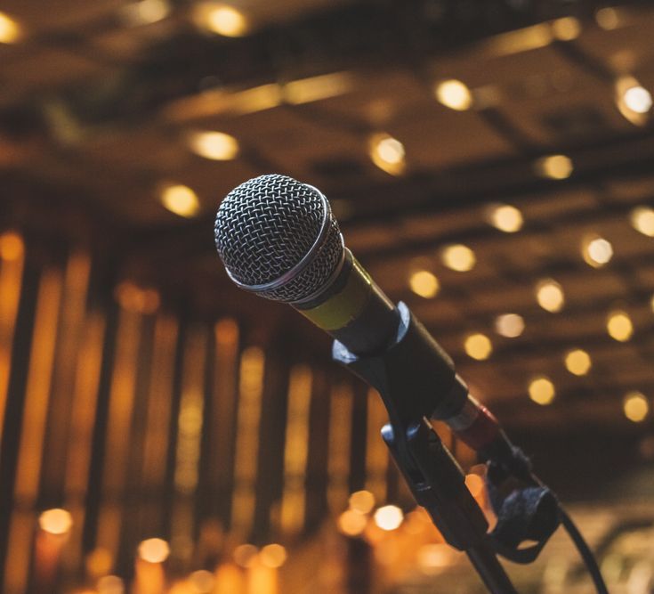 A close up of a microphone on a stand