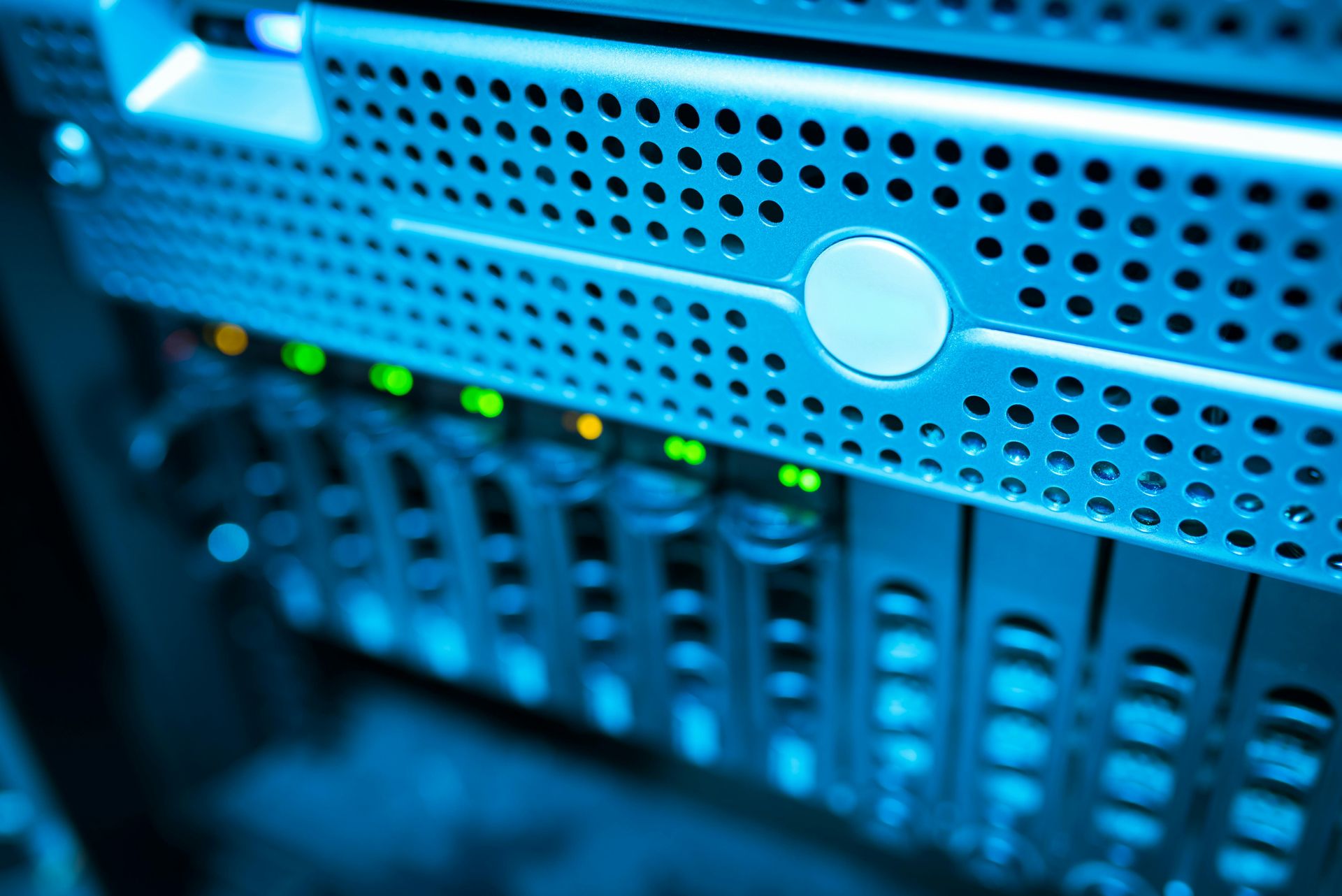 Blue server rack with glowing green indicator lights and perforated metal panels