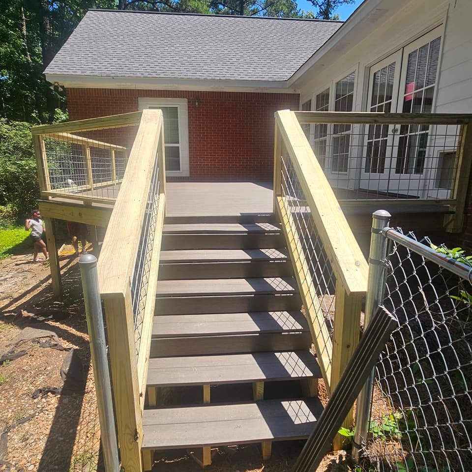 A wooden deck with stairs leading up to it