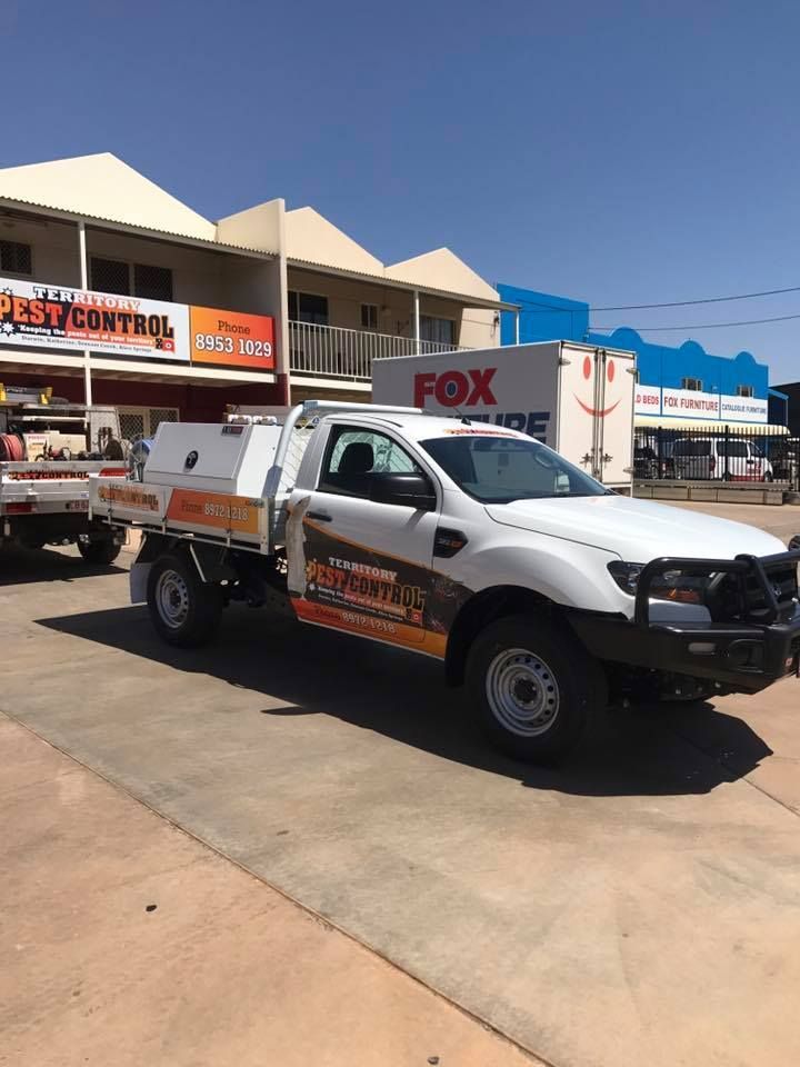 A Vehicle with Business Signage in Front of a Store  — Territory Pest Control In Winnellie, NT