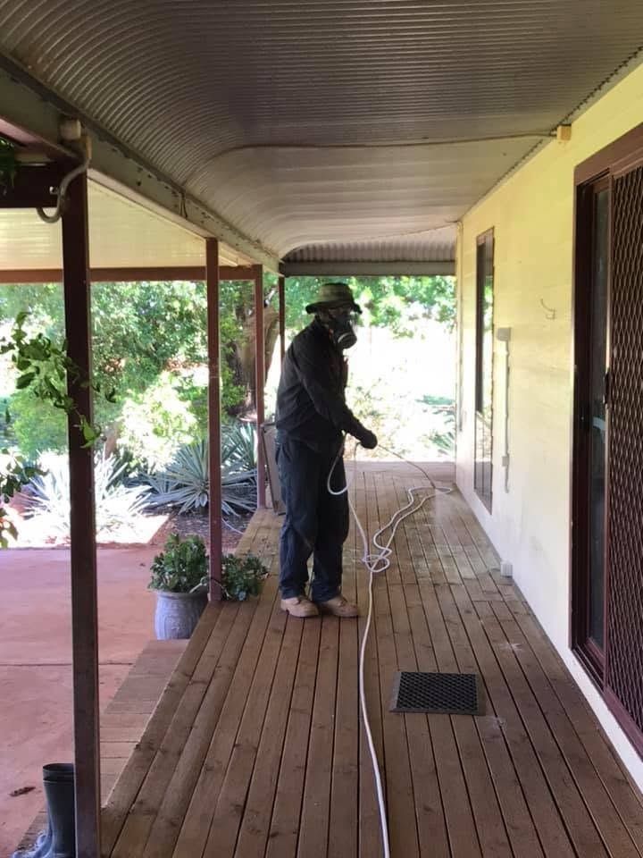 Worker Doing Termite Treatment in Darwin