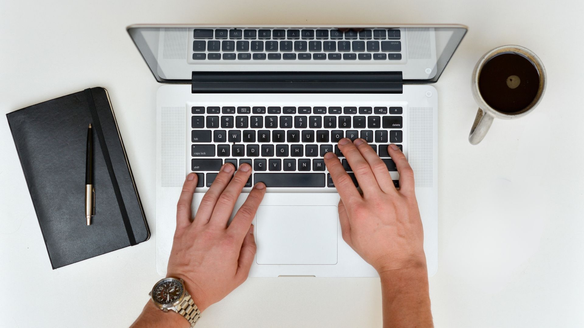 Showcasing Effective Email Campaigns through a photo of a digital marketer typing on a laptop.