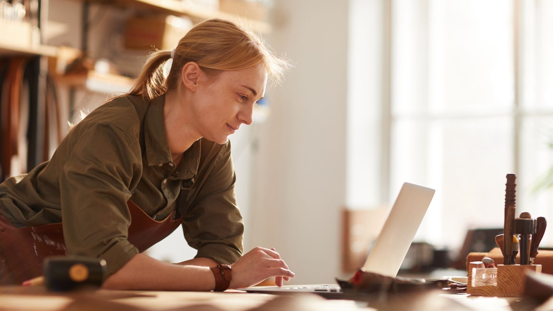 How do I Contact Google Customer Service as Shown by a Business Woman on Her Laptop