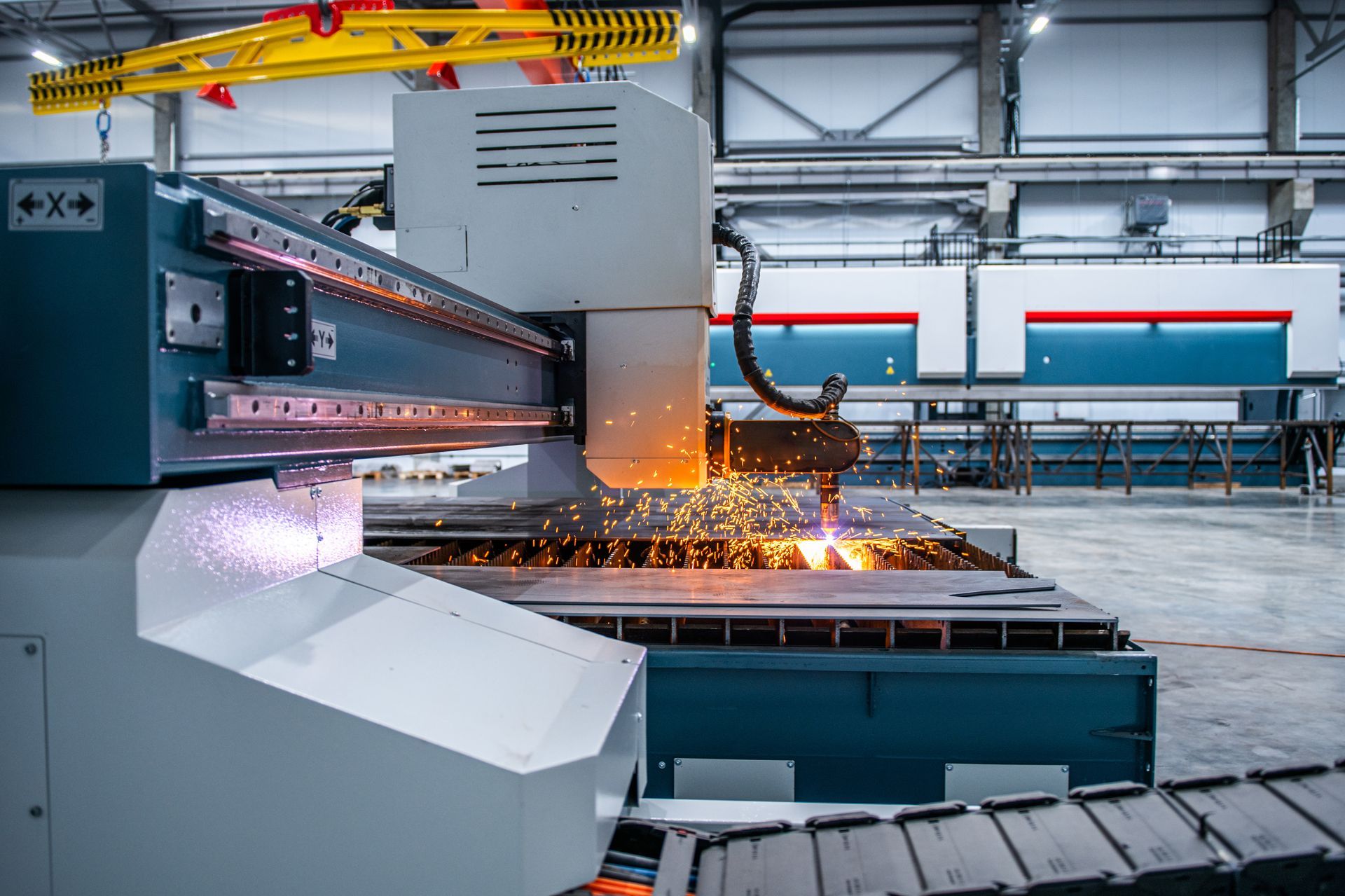 The sheet metal manufacturing process by a laser cutting machine.