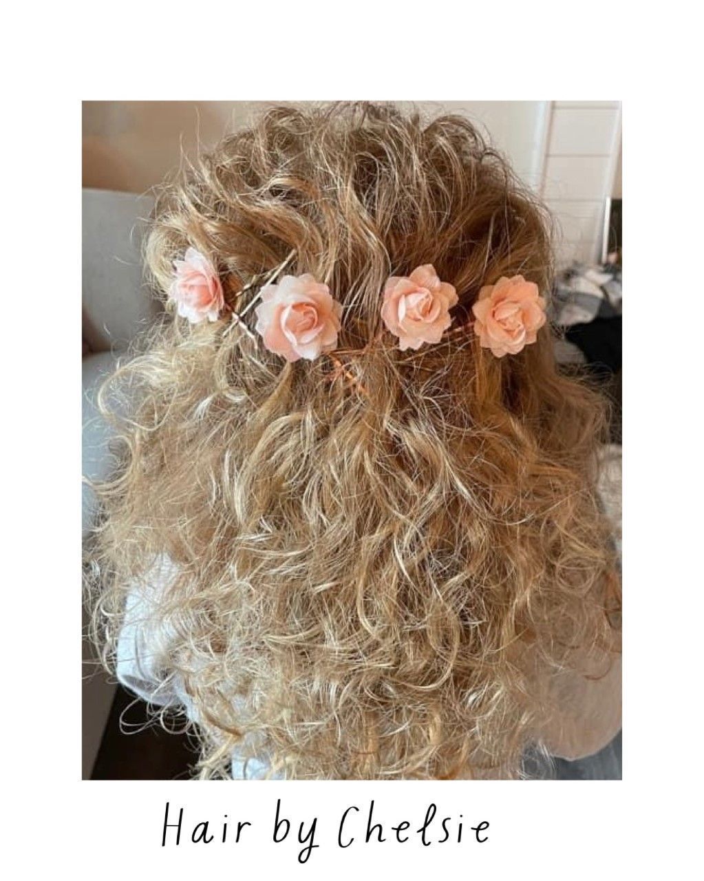 Curly blonde hair styled with a pink floral headband and “Hair by Chelsie” text