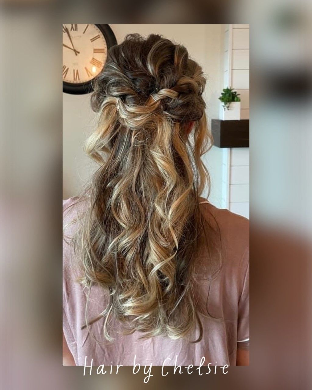 Half-up curly hairstyle with loose waves and a dark ribbon bow, viewed from behind