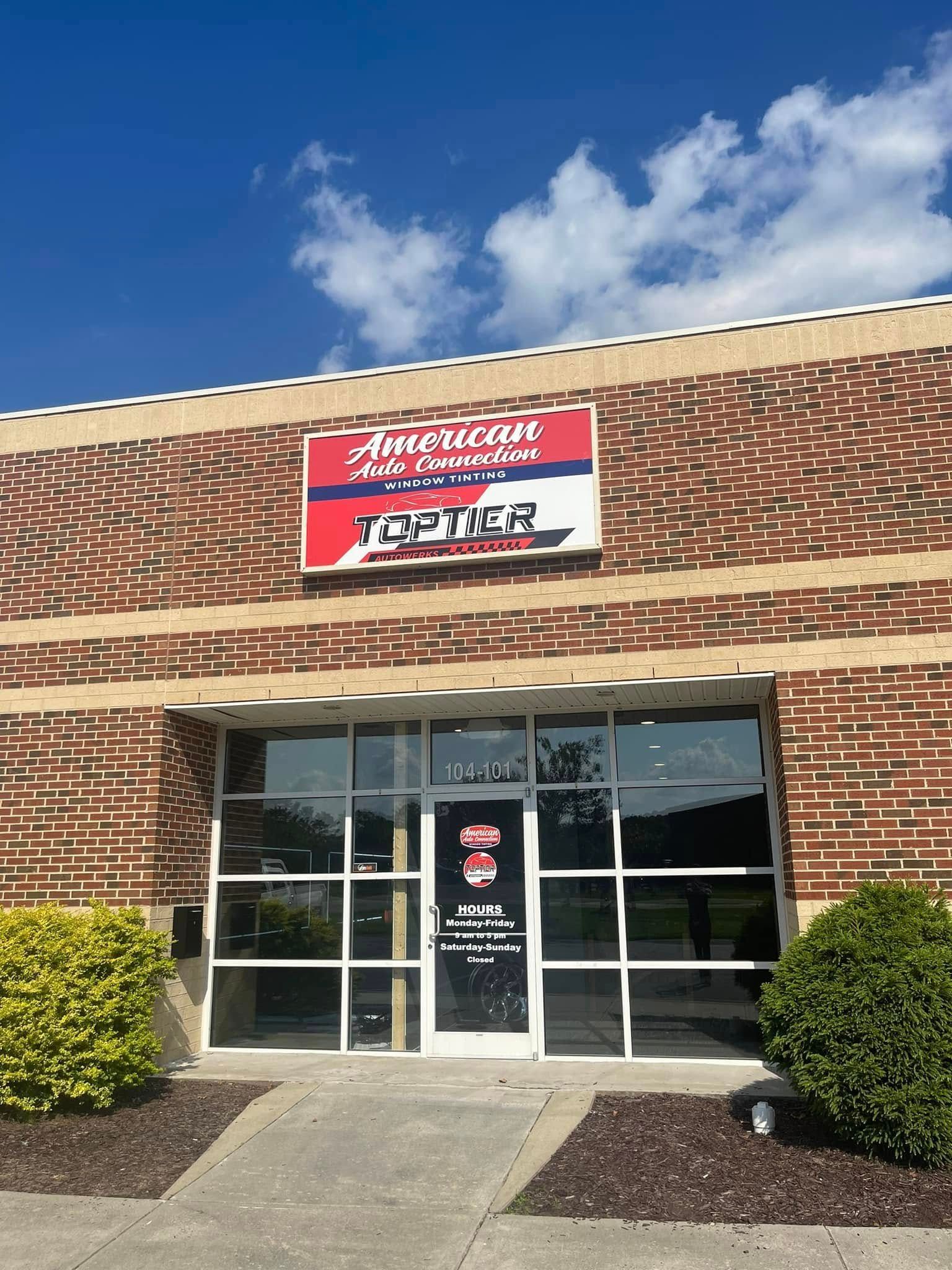 Exterior of American Air Systems business with brick facade and sign.