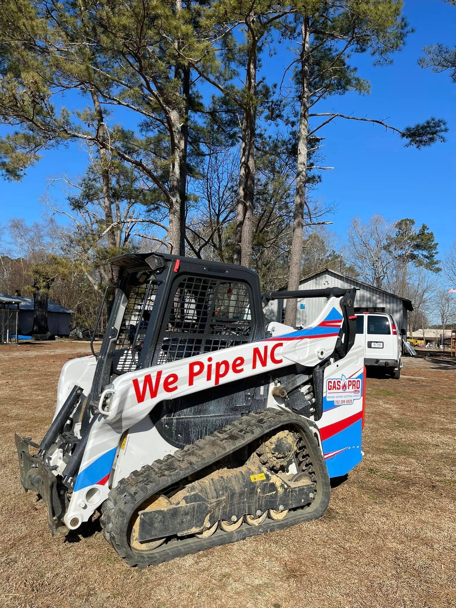 White and black skid steer with