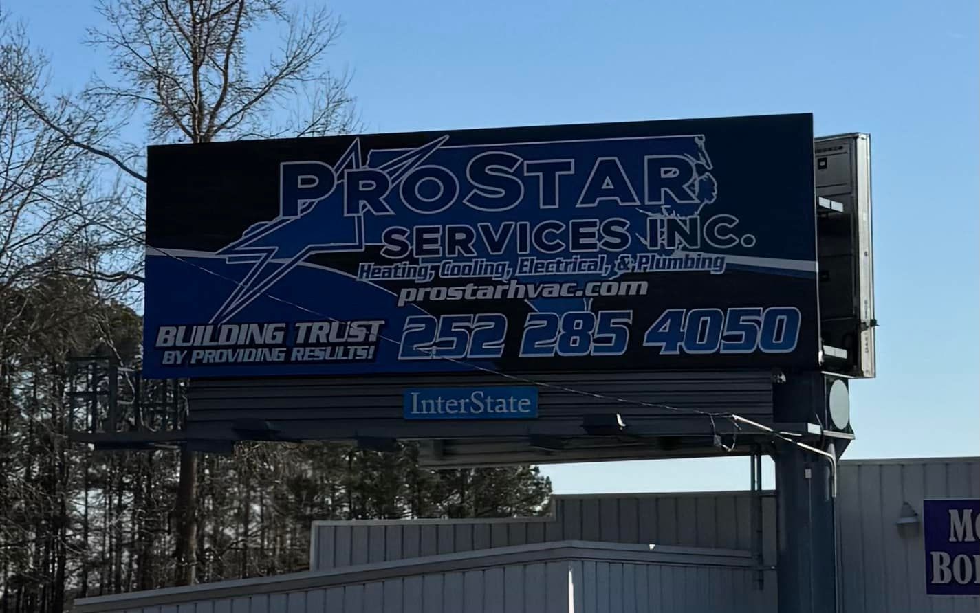 Billboard for ProStar Services Inc., advertising HVAC services, with blue and white logo, phone number, and website address.