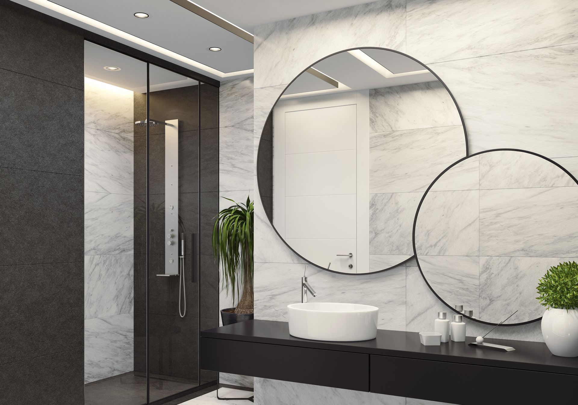Modern bathroom with marble walls, black vanity, round mirrors, white sink, and glass shower. Modern bathroom with marble walls, black vanity, round mirrors, white sink, and glass shower.