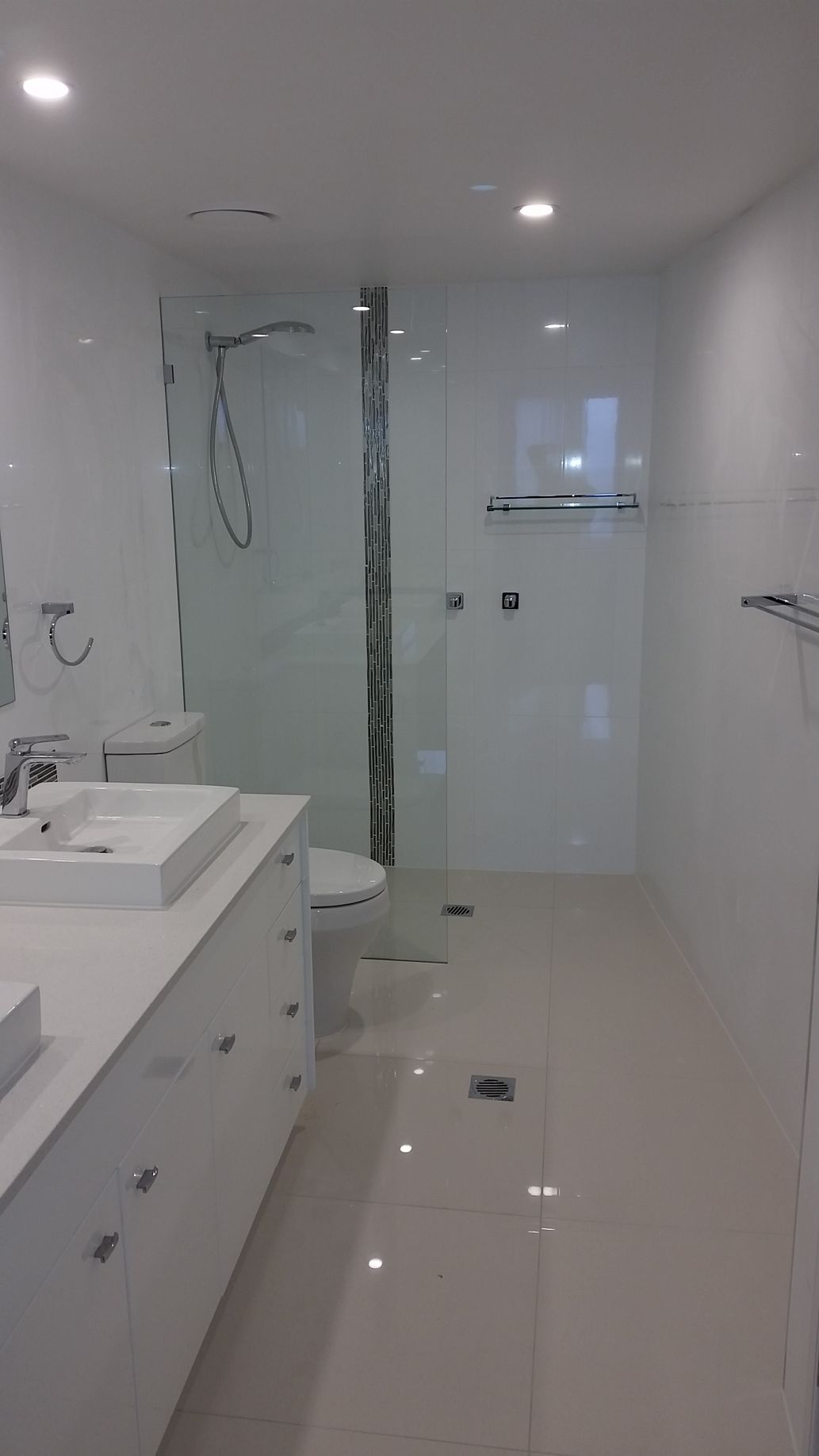 A Bathroom With Two Sinks, a Toilet, and a Walk in Shower  — Scott Graham Building Services In Bilambil Heights, NSW 