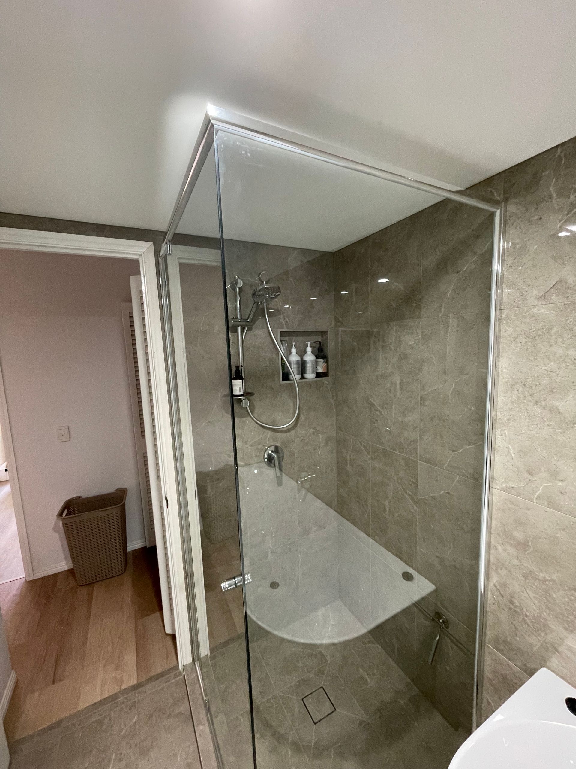 A Bathroom With a Walk in Shower and a Bathtub  — Scott Graham Building Services In Bilambil Heights, NSW 