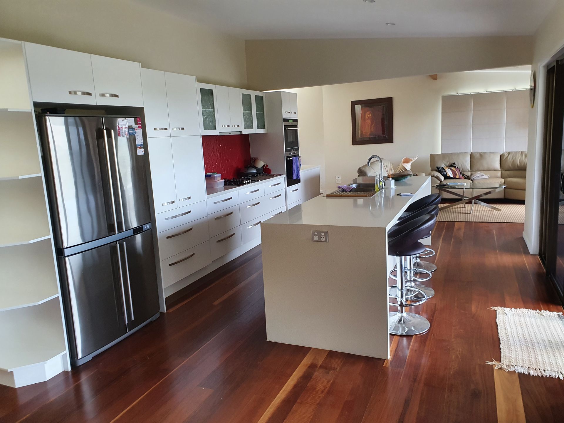 A Kitchen With Stainless Steel Appliances and White Cabinets  — Scott Graham Building Services In Bilambil Heights, NSW 