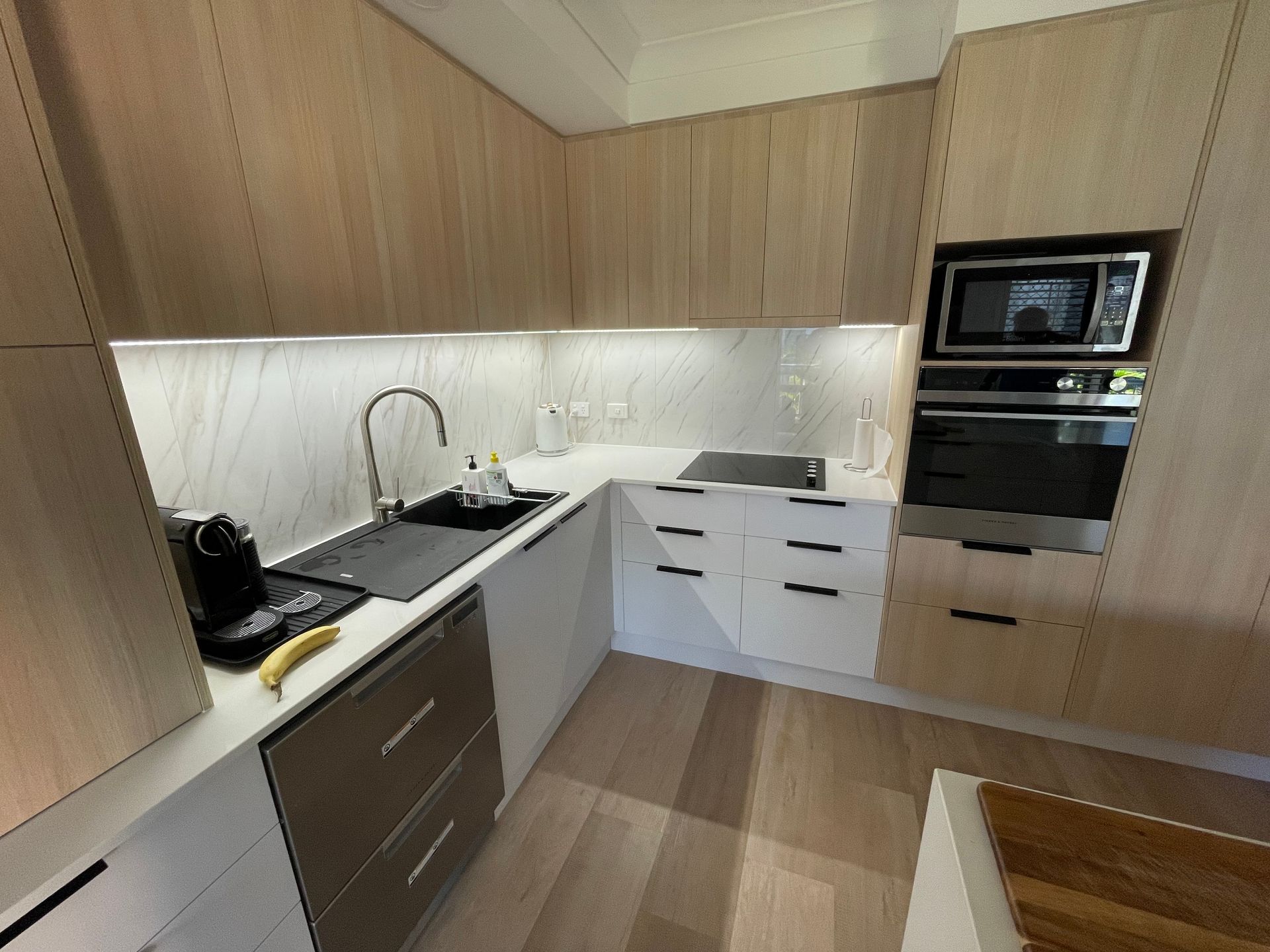There Is A Washer And Dryer In The Laundry Room — Scott Graham Building Services In Mermaid Beach, QLD