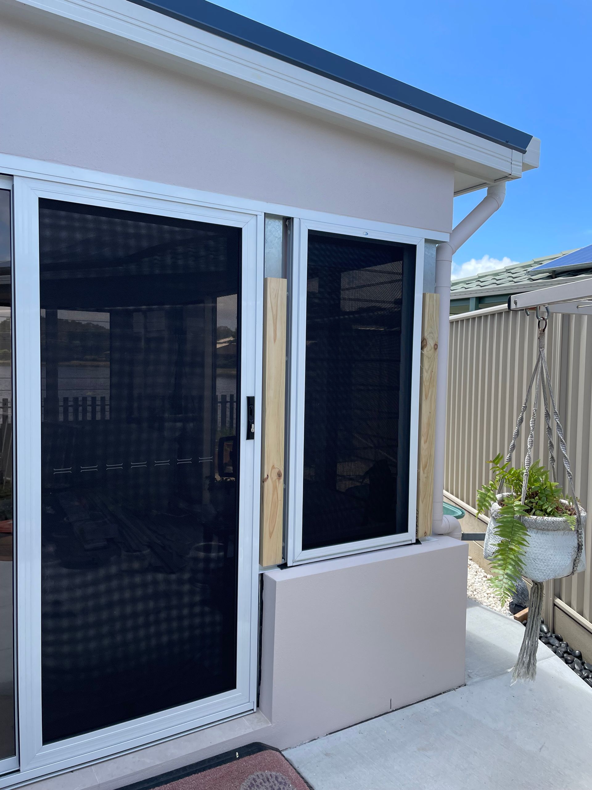 A House With a Sliding Glass Door and a Window — Scott Graham Building Services In Bilambil Heights, NSW