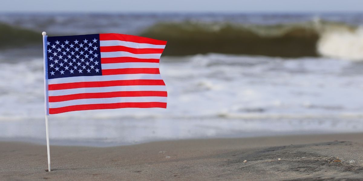American flag flying on a beach