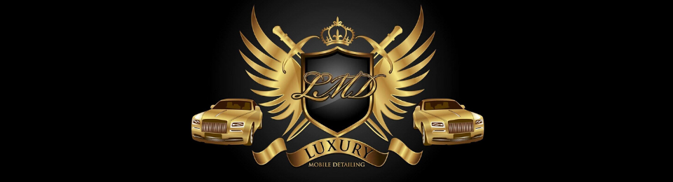 Gold winged skull emblem with crossed pistols and a ribbon banner on a black background