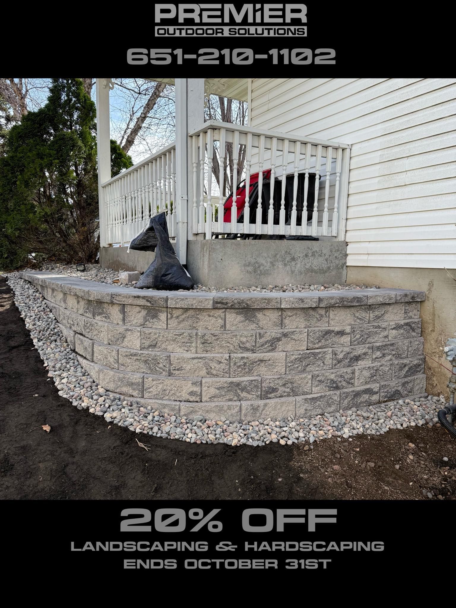 An advertisement for Premier landscaping shows a stone retaining wall against a porch with a 20% off offer until Oct 31st.