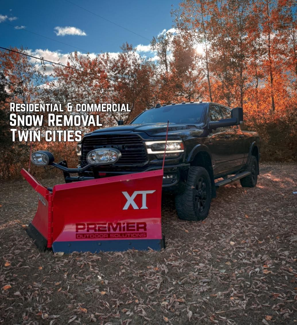 Black pickup truck with a red snowplow parked in an autumn forest. Text reads: Residential & Commercial Snow Removal.