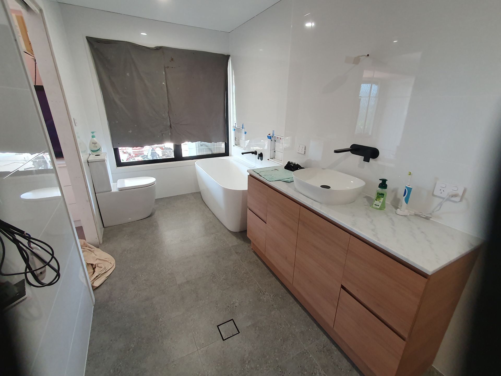 A Bathroom With A Sink And A Shower Stall — Damn Fine Constructions In Bonville, NSW