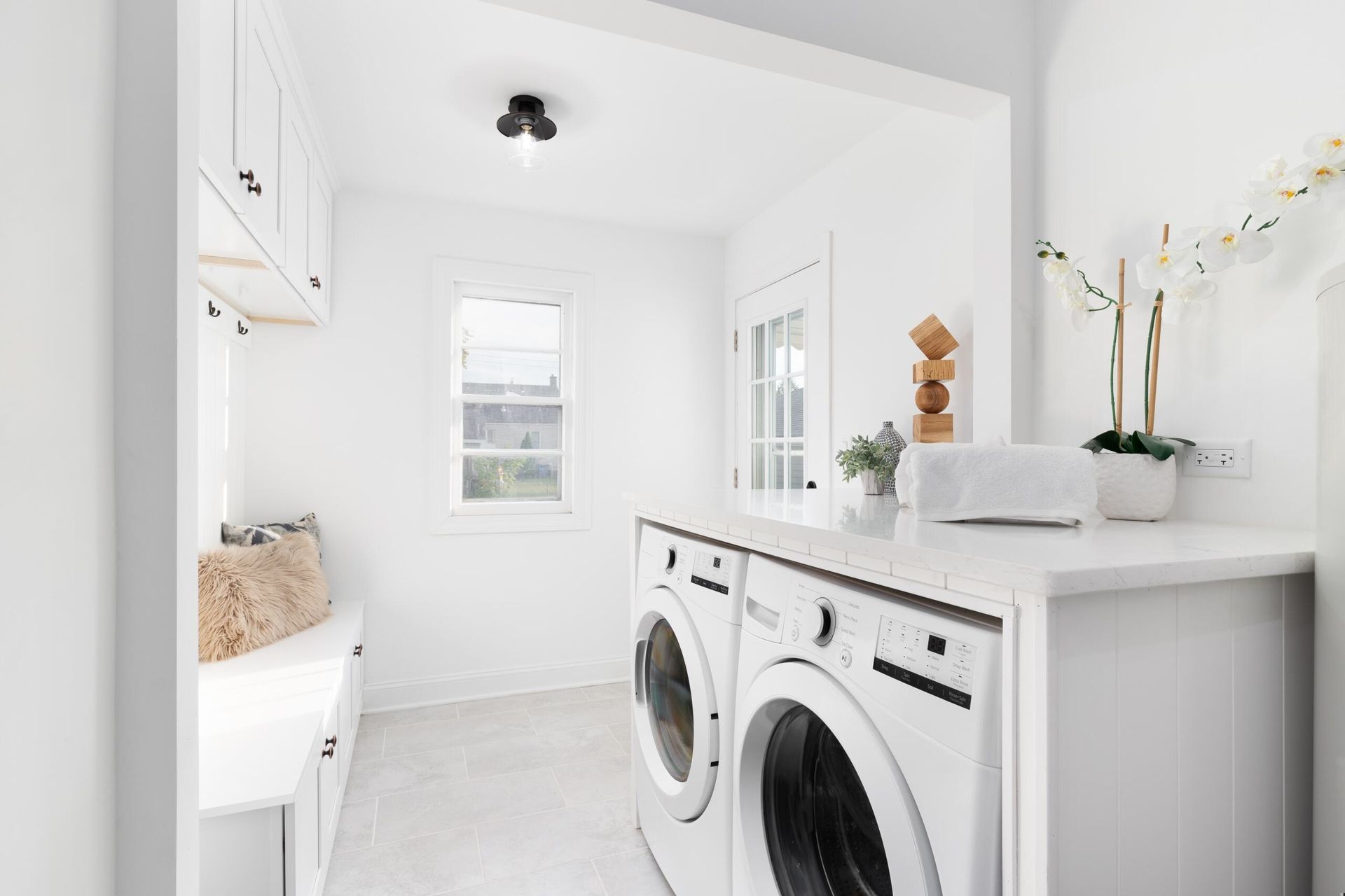 A Laundry Room With A Washer And Dryer In It — Damn Fine Constructions In Sawtell, NSW