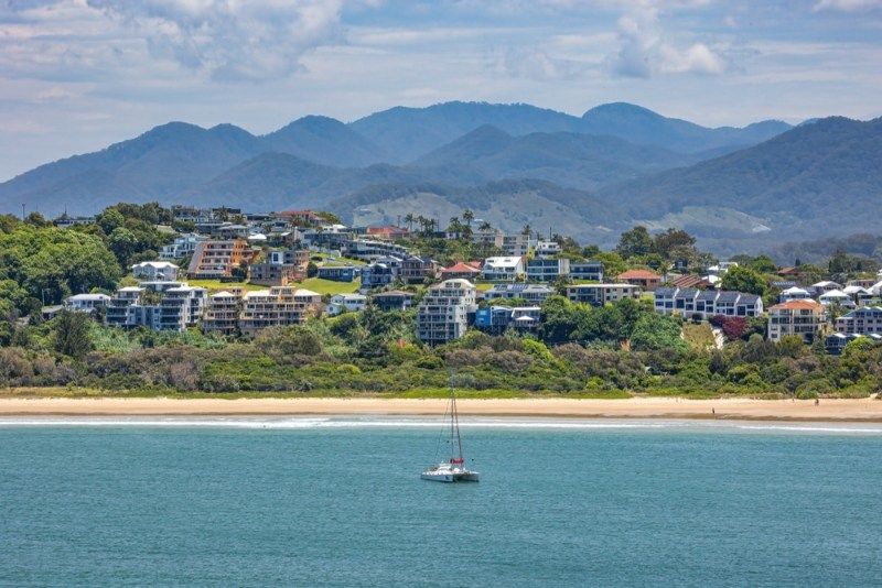 A Large Body Of Water And Buildings In Toormina — Damn Fine Constructions In Toormina, NSW