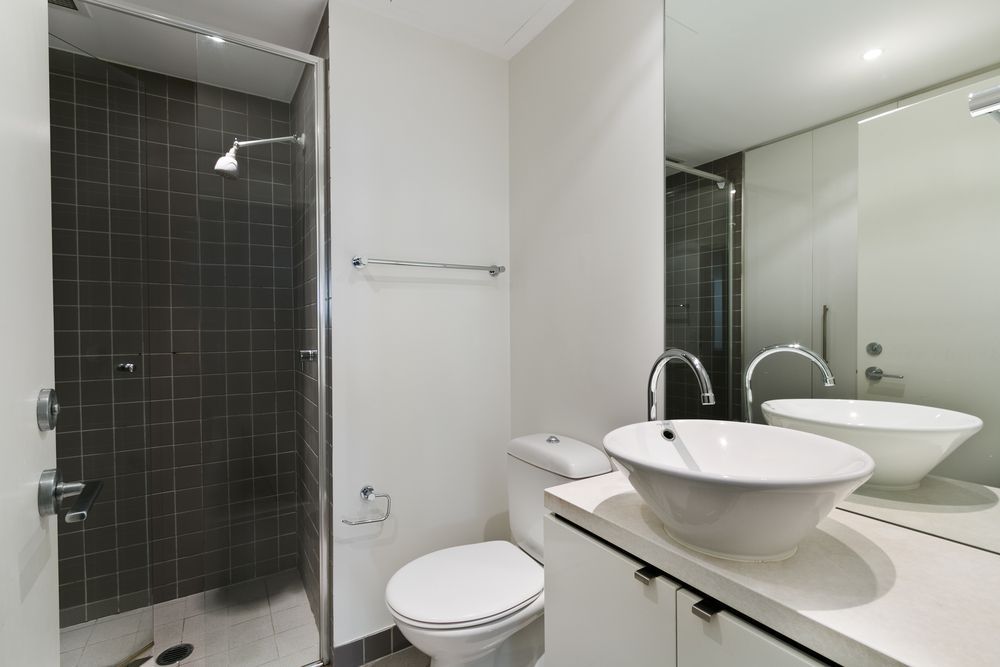 A Bathroom With A Toilet, Sink And Shower — Damn Fine Constructions In Bellingen, NSW